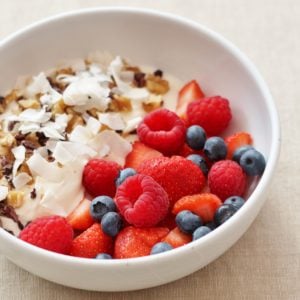 Sirtfood Breakfast of Yoghurt, Berries, Walnuts, Coconut Flakes and Cacao Nibs