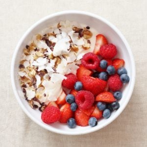 Sirtfood Breakfast of Yoghurt, Berries, Walnuts, Coconut Flakes and Cacao Nibs