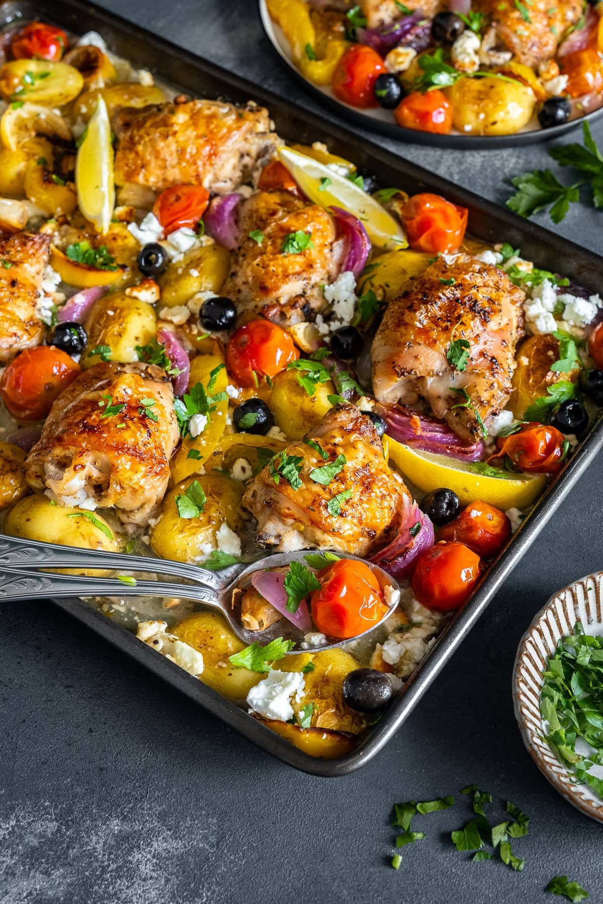 Closeup of Greek Chicken Traybake in the tray.