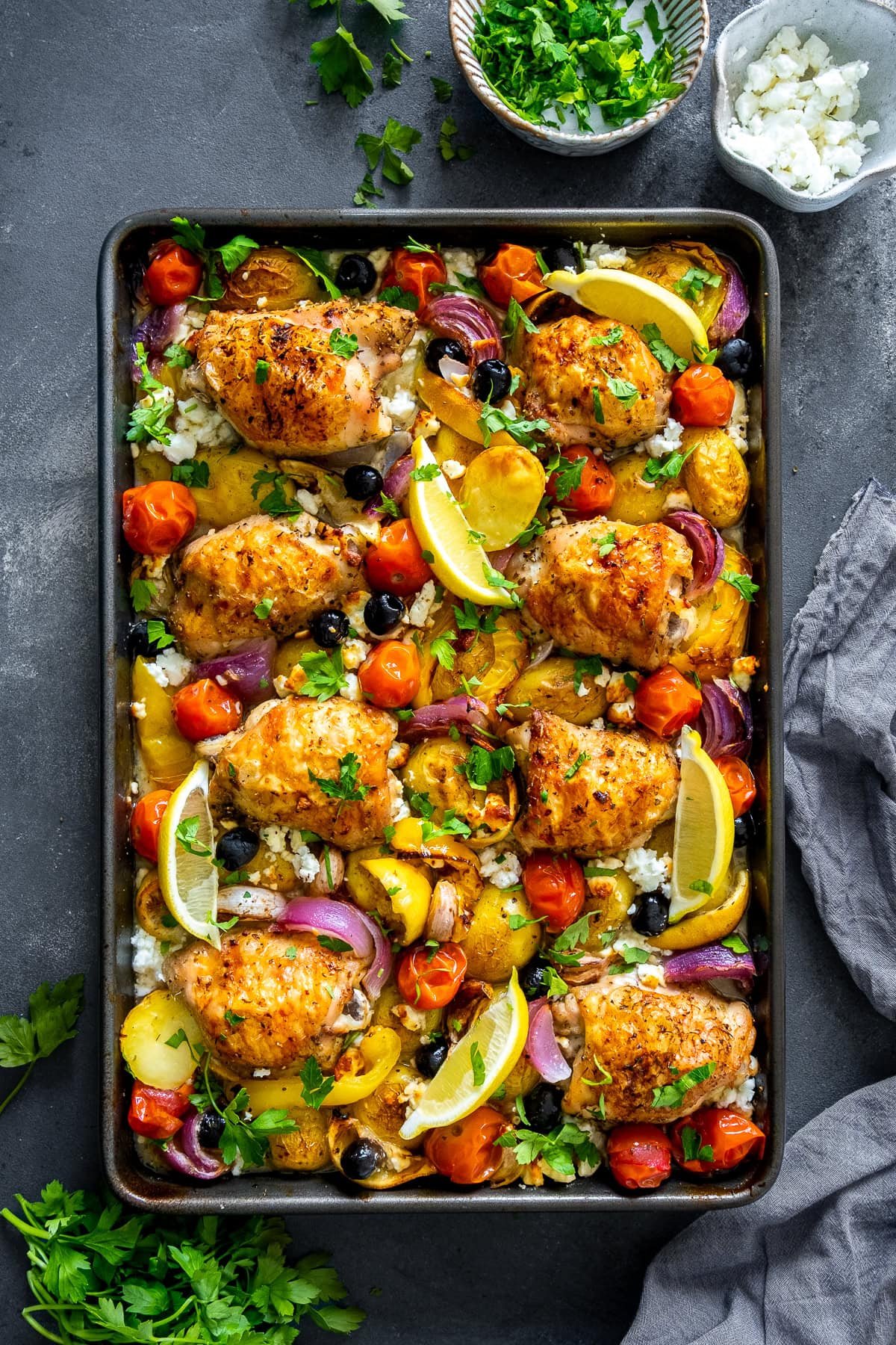 Overhead shot of Greek Chicken Traybake in the tray.