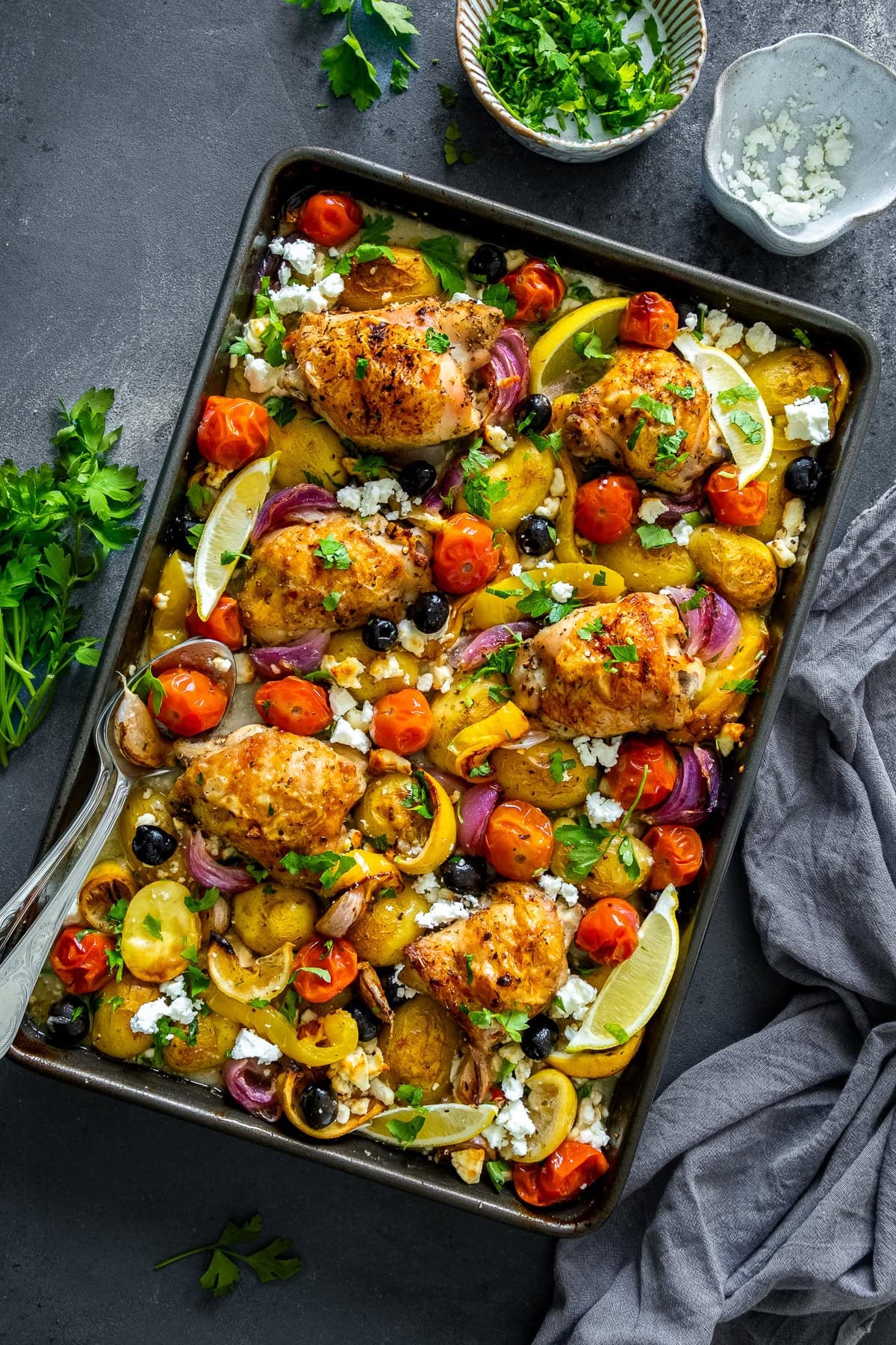 Overhead shot of Greek Chicken Traybake in the tray.