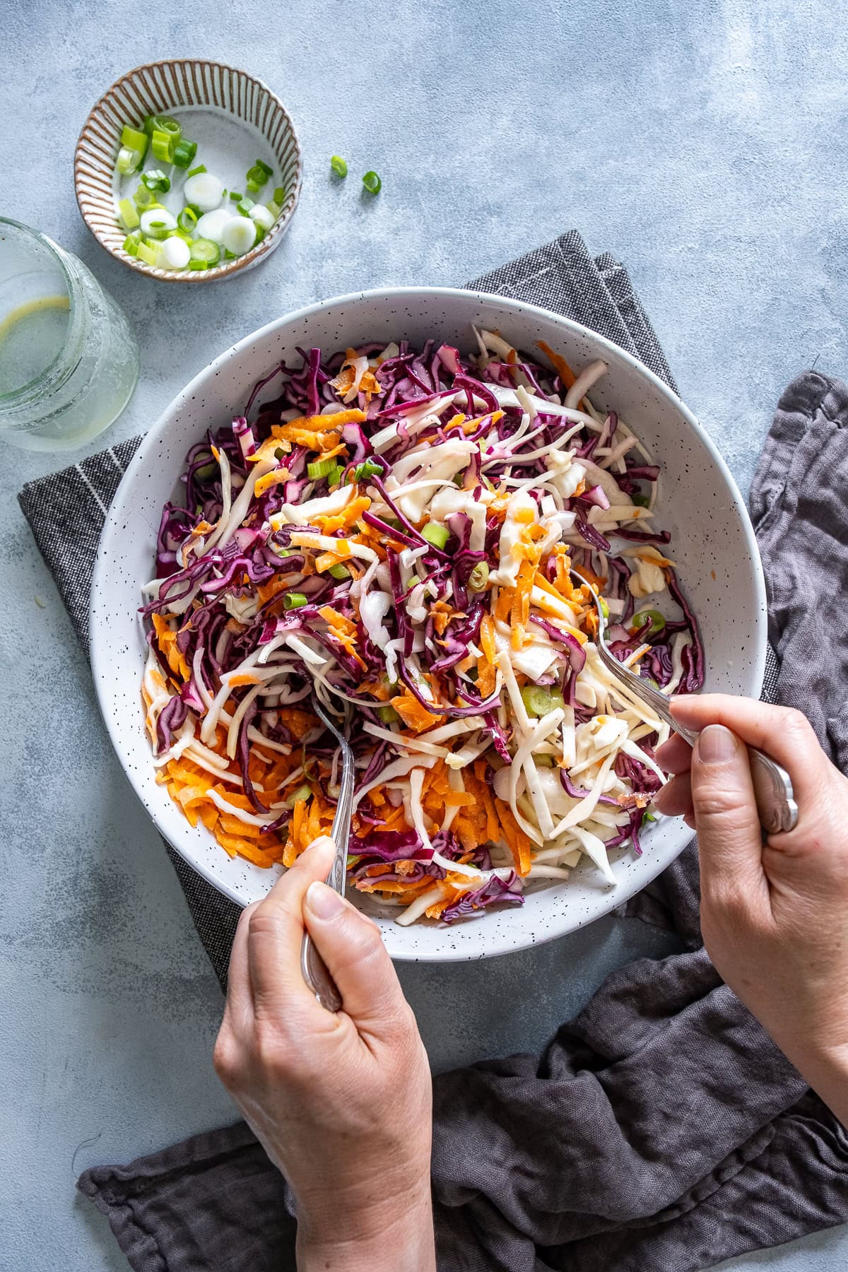 Overhead shot of Easy No Mayo Coleslaw being mixed.