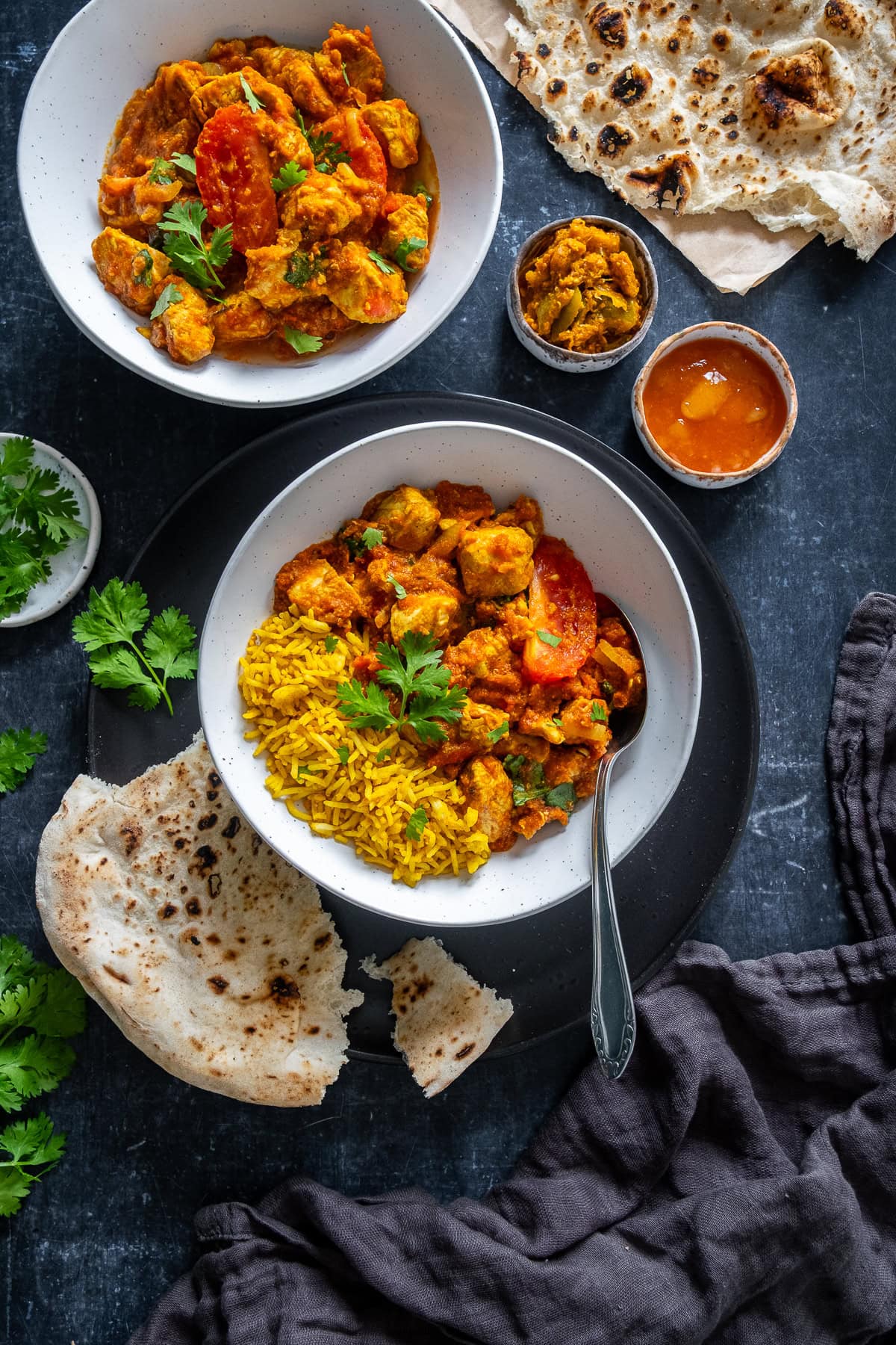 Overhead shot of Easy Chicken Rogan Josh in a bowl with Pilau Rice.