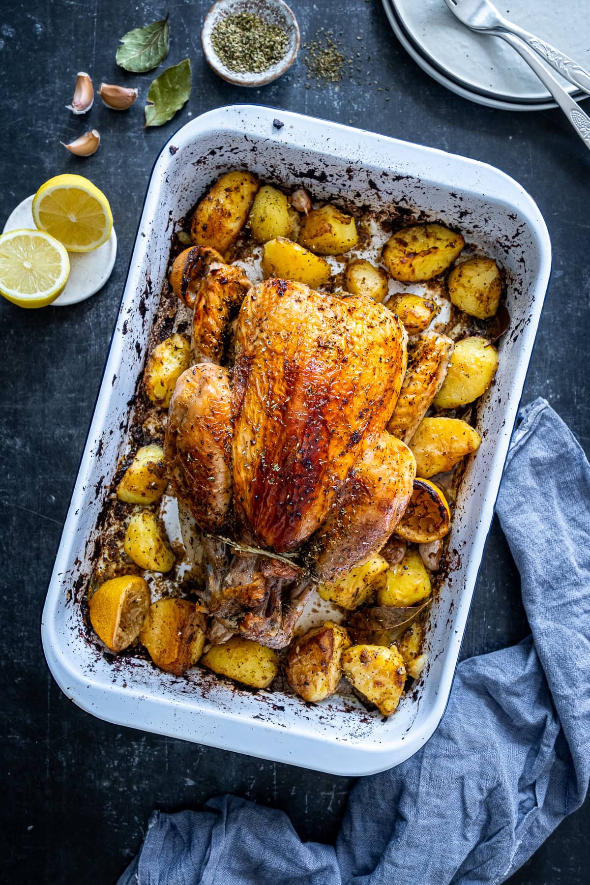 Overhead shot of One Pan Greek Roast Chicken and Roast Potatoes in the pan.