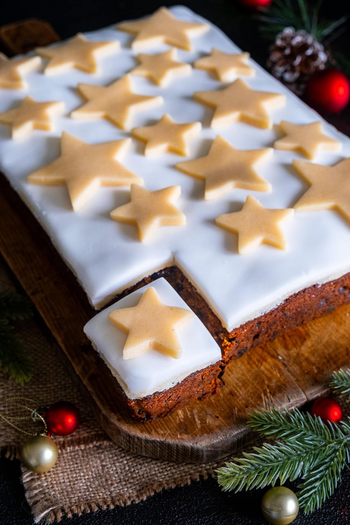 Easy Christmas Cake Traybake with one piece cut out.