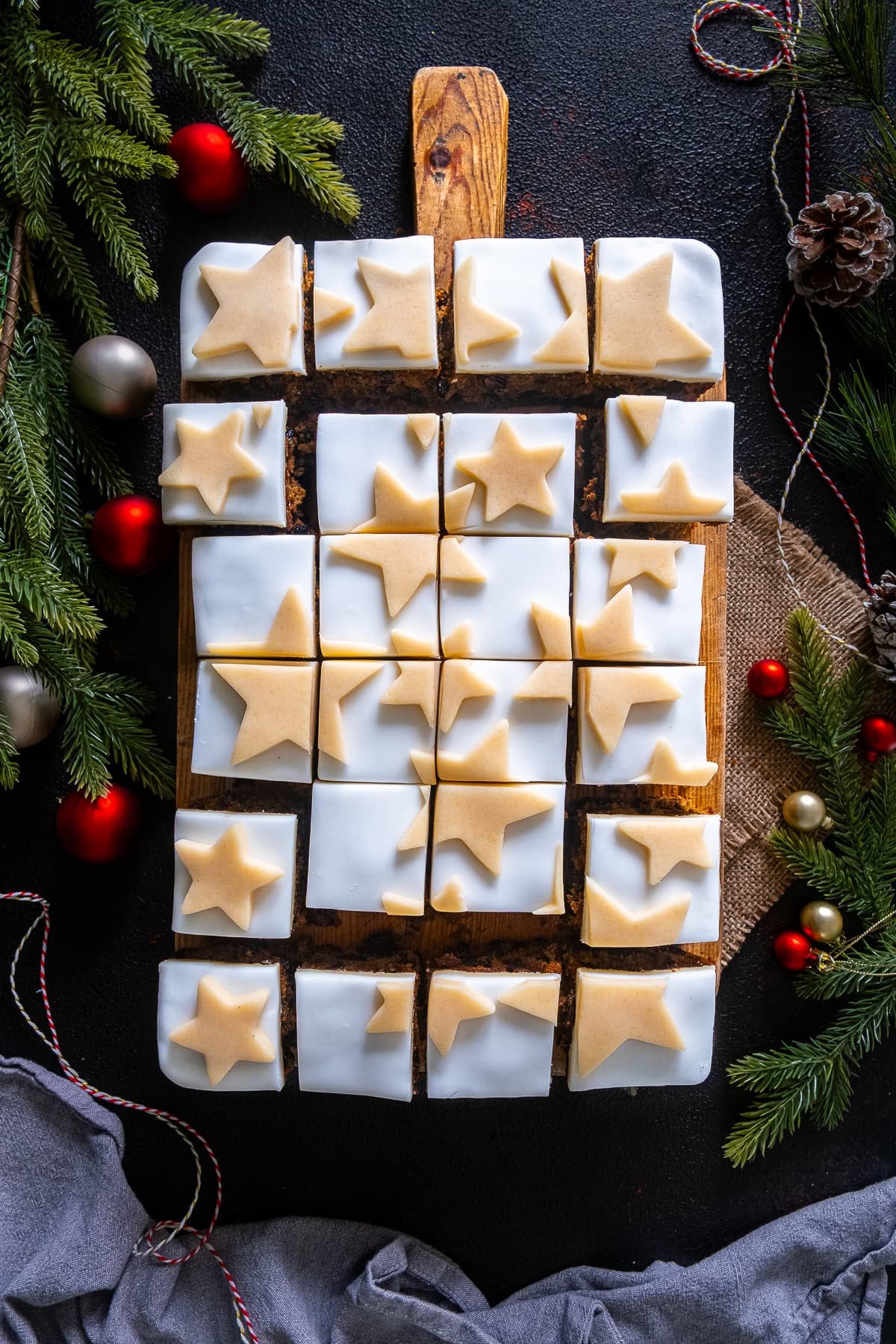 Overhead shot of Easy Christmas Cake Traybake cut into squares.