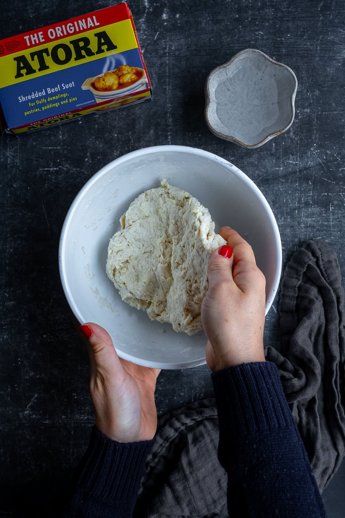Woman kneading dough for Traditional British Suet Dumplings with Atora