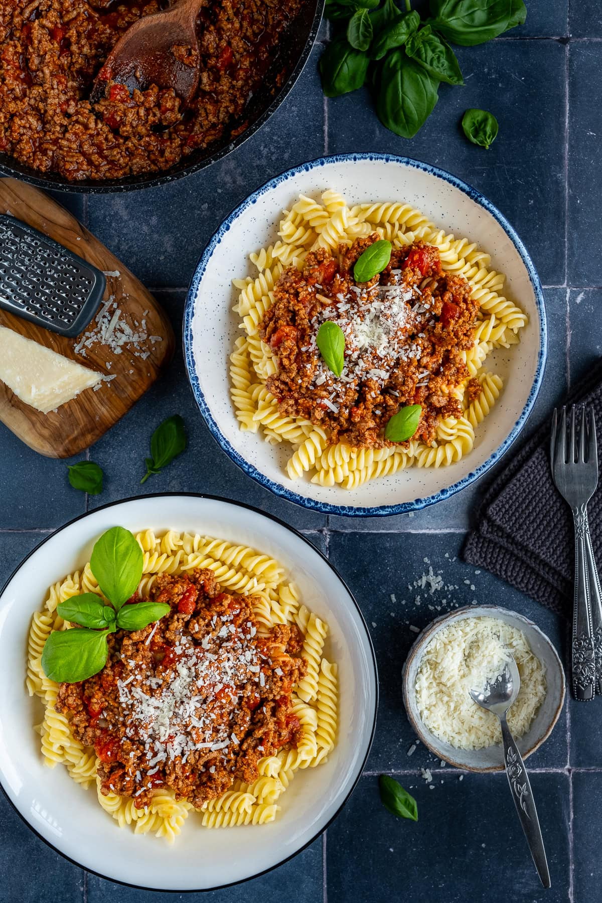 Overahead shot of 2 bowls of Fusilli Bolognese
