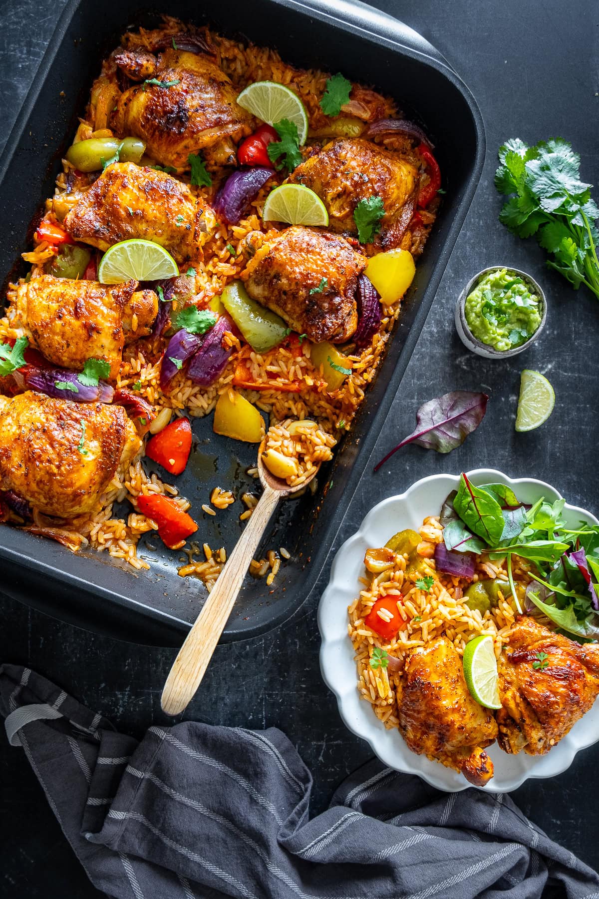 Mexican Chicken And Rice in the pan and 1 serving on a plate.