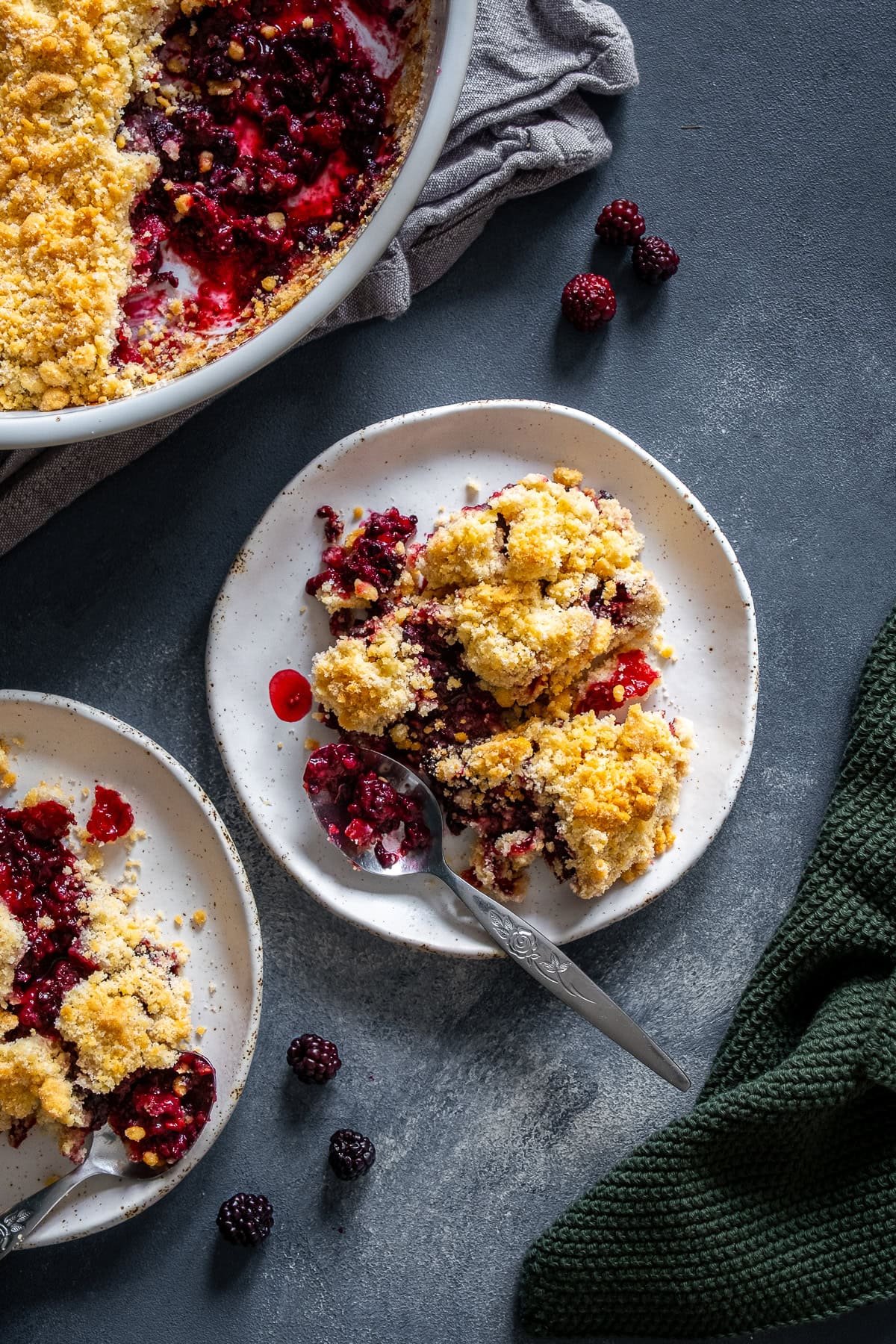 Overhead shot of 2 plates of Easy Blackberry Crumble