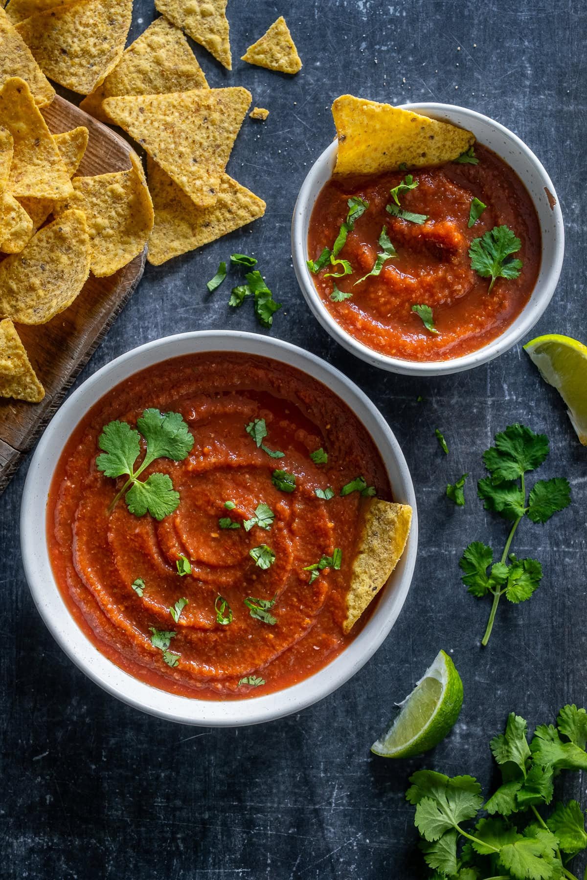 Overhead shot of 2 bowls of 5 Minute Blender Salsa, surrounded by tortilla chips.