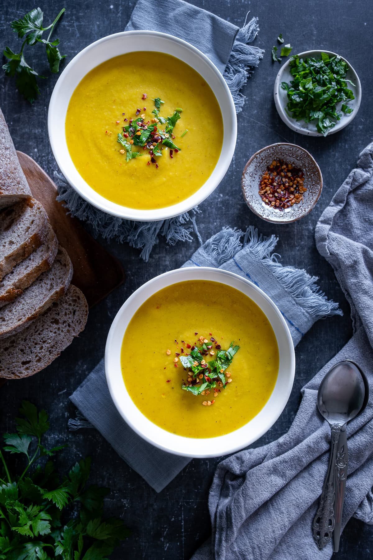 Overhead shot of 2 bowls of Easy Roasted Parsnip Soup