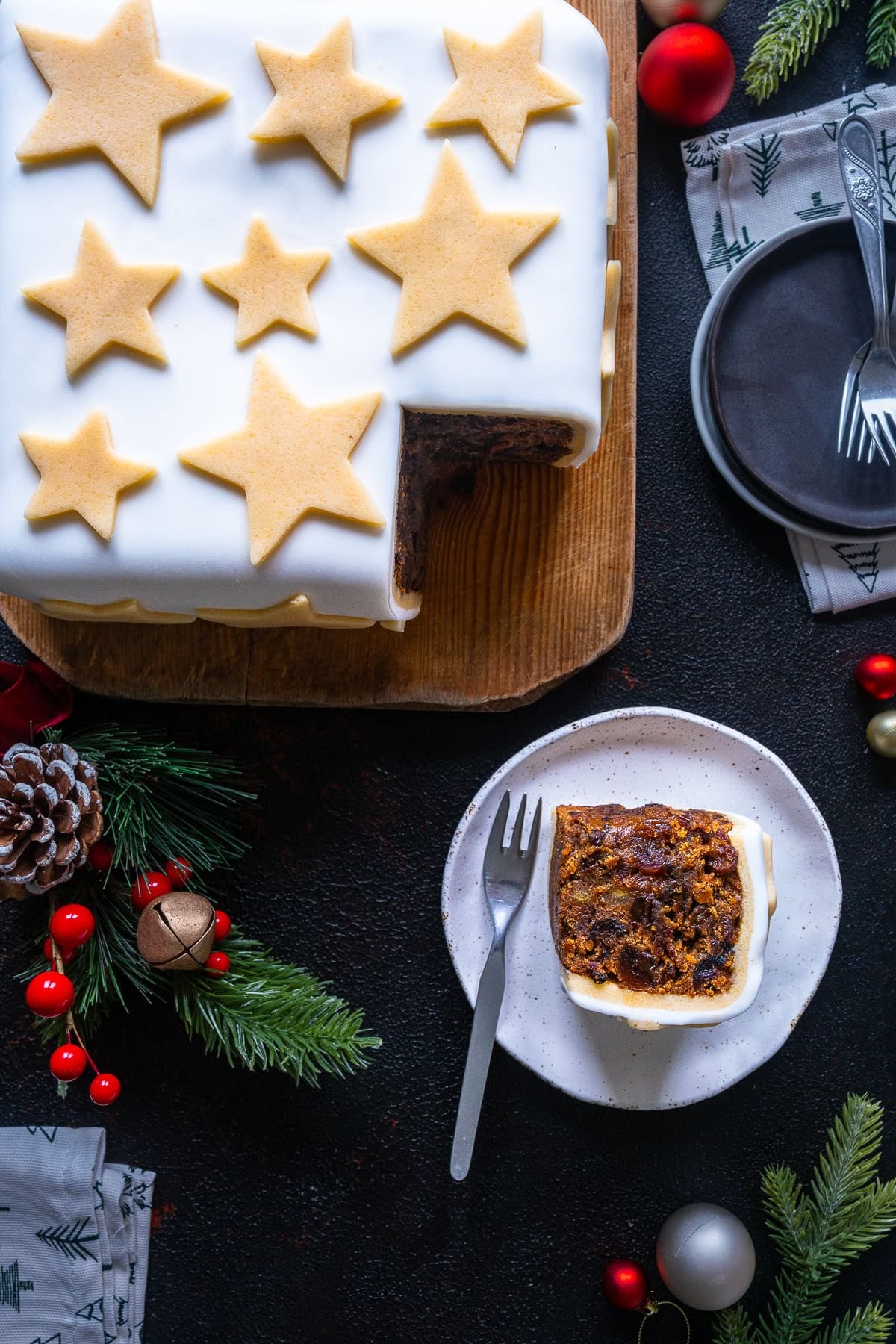 Overhead shot of Easy Square Christmas Cake with one slice taken out and on a plate.