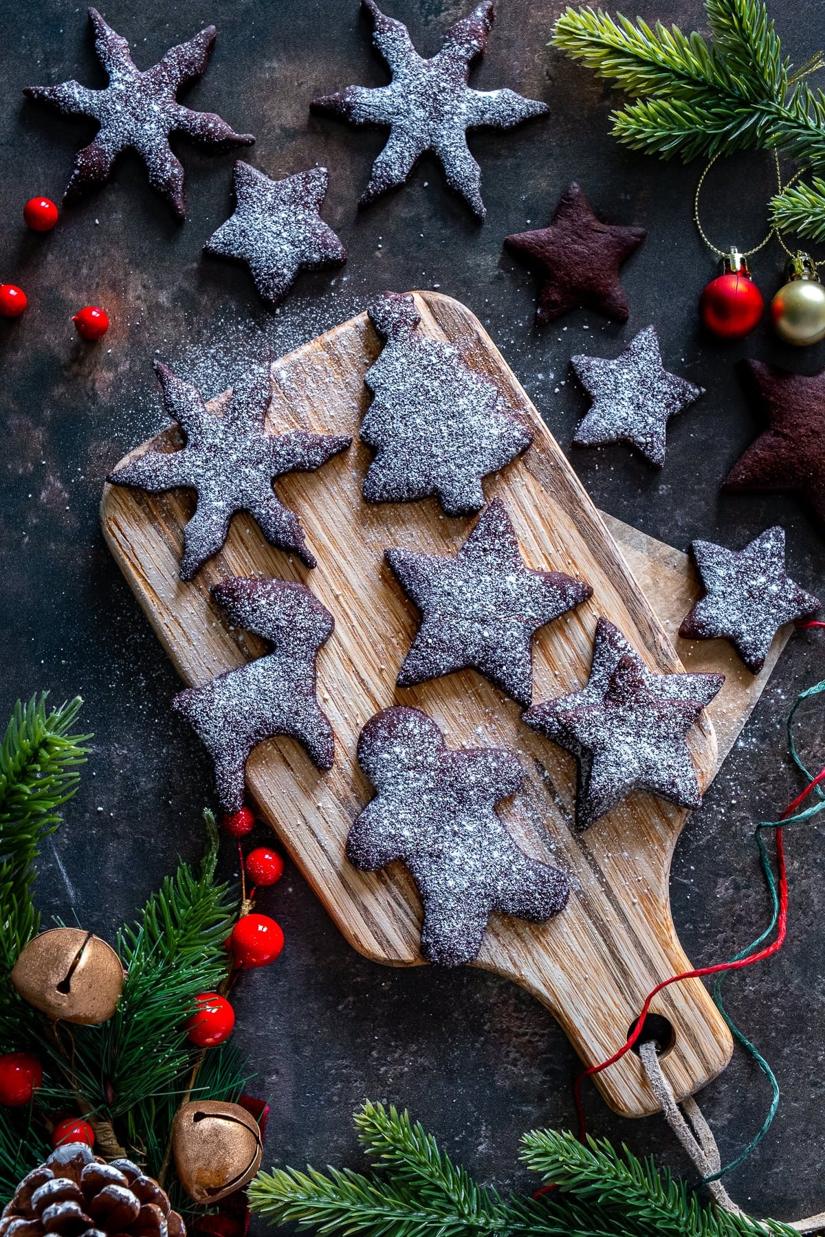 Overhead shot of Easy Chocolate Christmas Biscuits on a small chopping board.