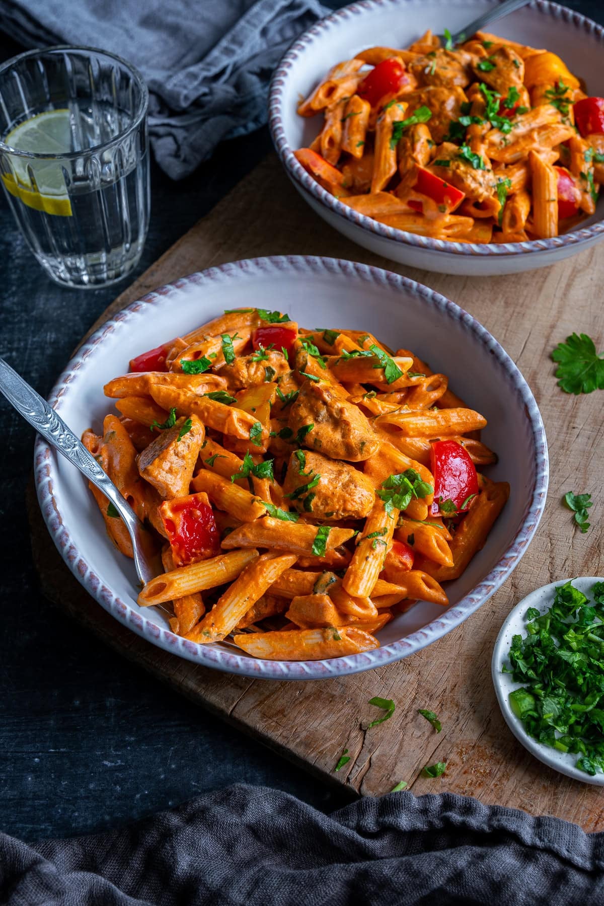 Closeup of 2 bowls of Creamy Cajun Chicken Pasta