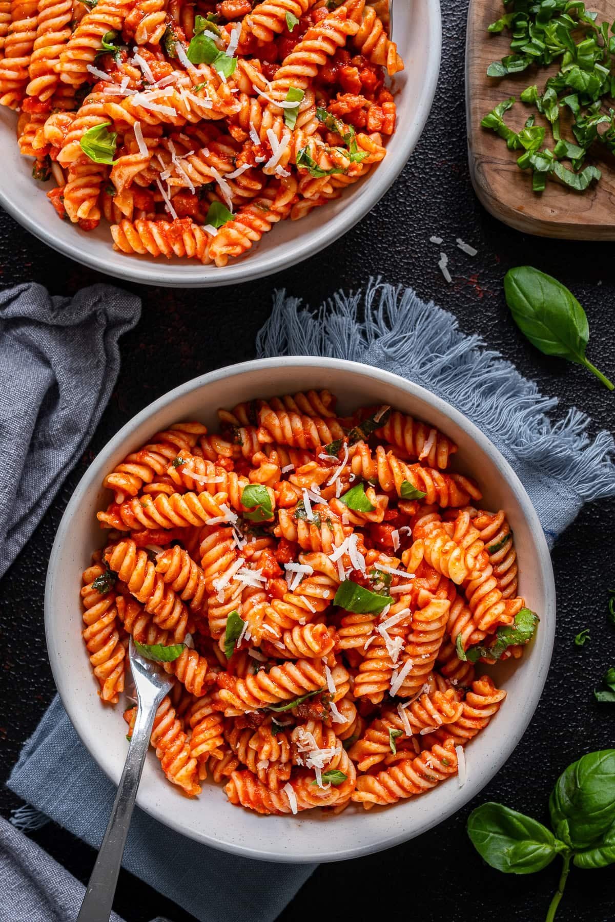 Overhead shot of 2 bowls of Easy Bacon and Tomato Pasta
