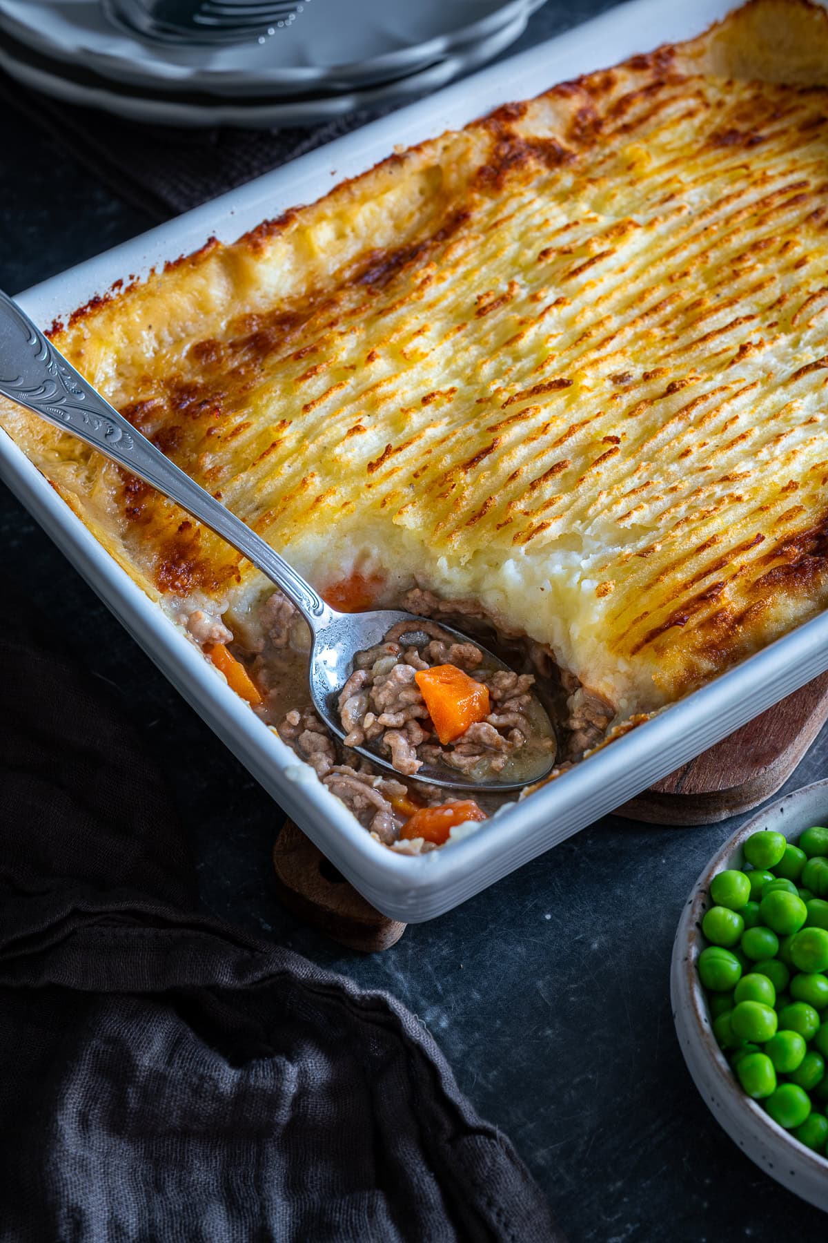 Easy Peasy Shepherd’s Pie in the dish with one spoonful taken out.