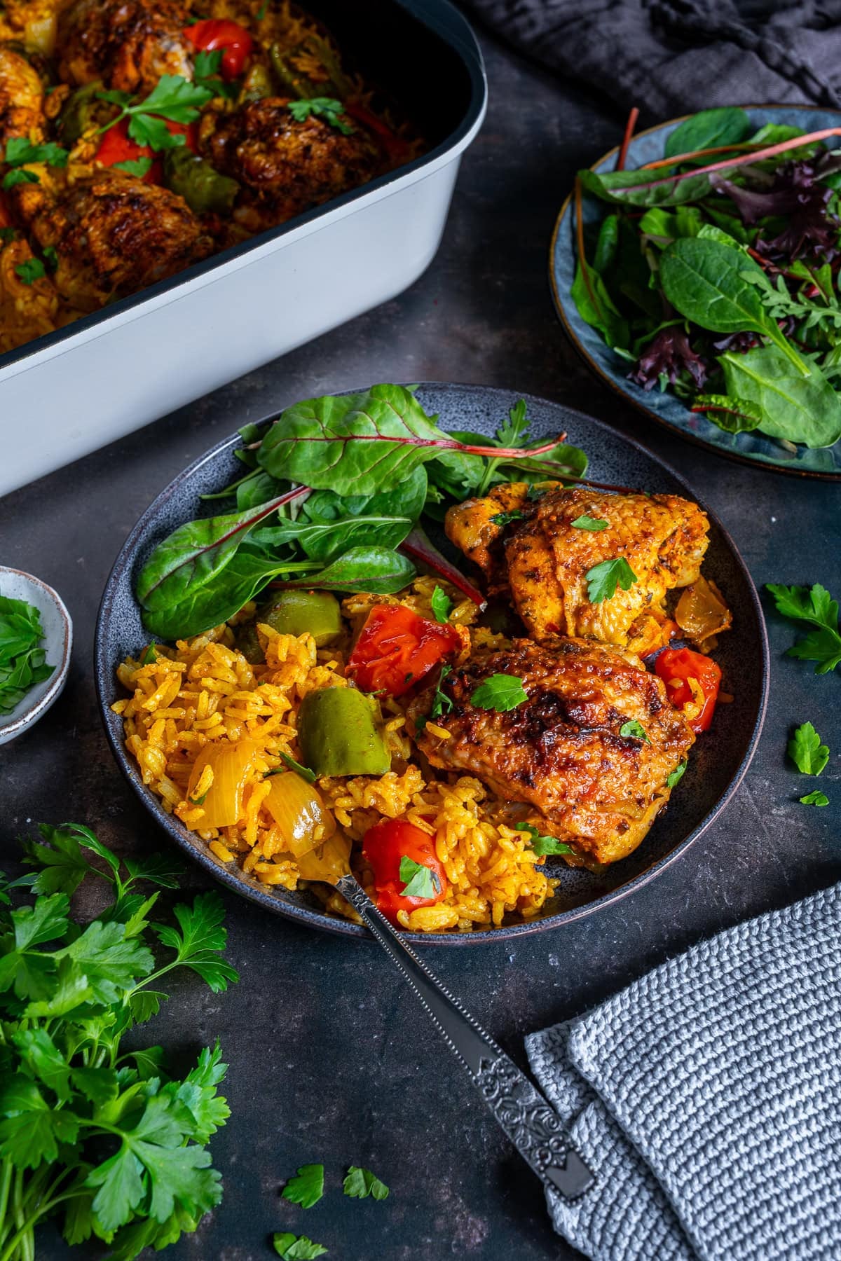 Nando’s Portuguese Chicken and Rice on a plate with salad.