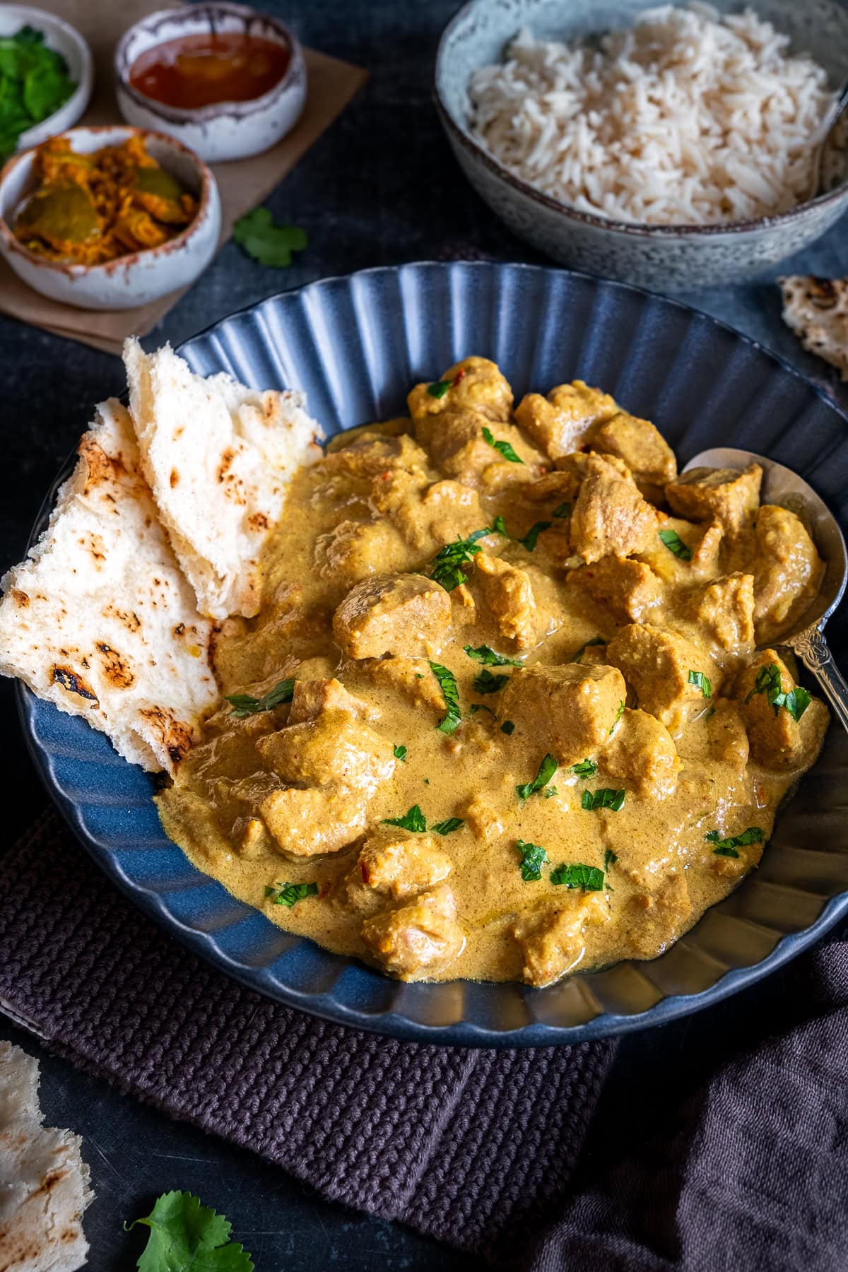 Easy Lamb Korma in a bowl with naan.