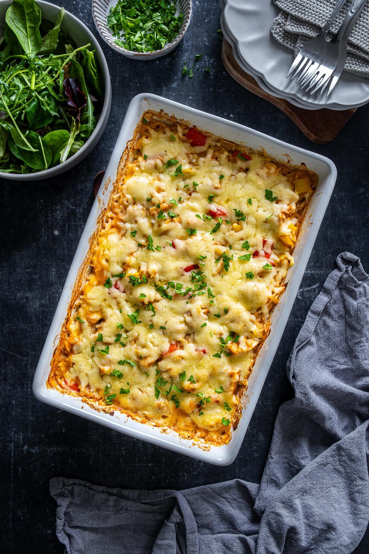 Overhead shot of Chicken Fajita Rice Bake in the oven dish.