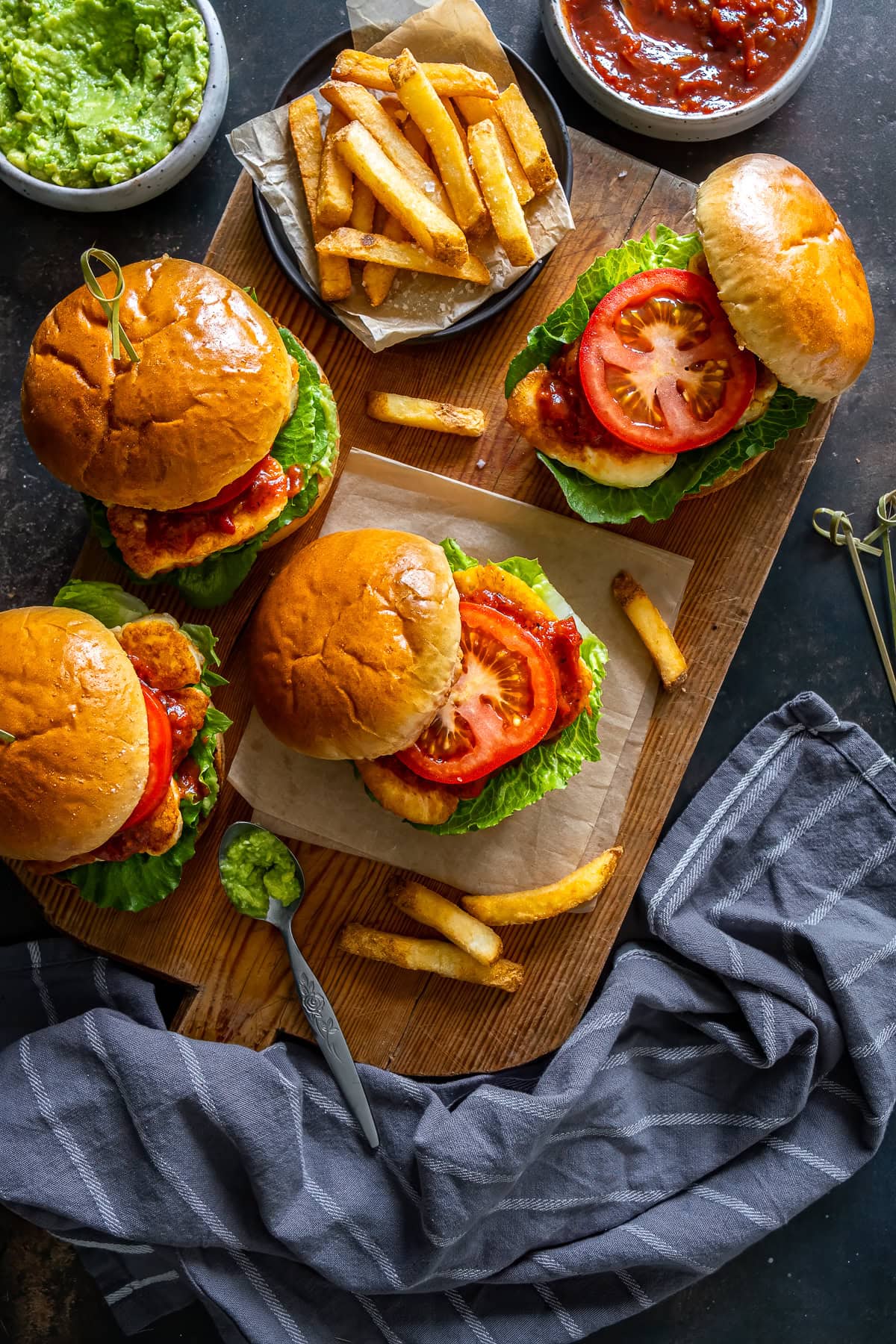 Overhead shot of 4 Halloumi Burgers with fries.