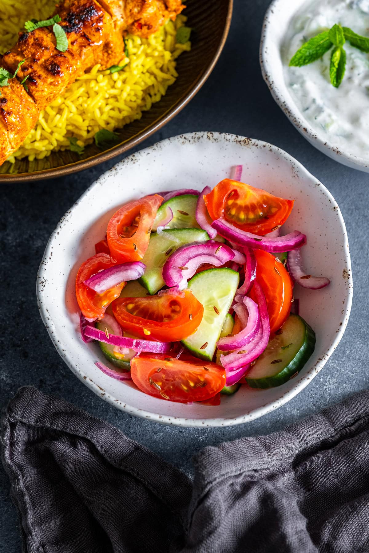 Kachumber Salad with Chicken Tikka Kebabs and Raita.