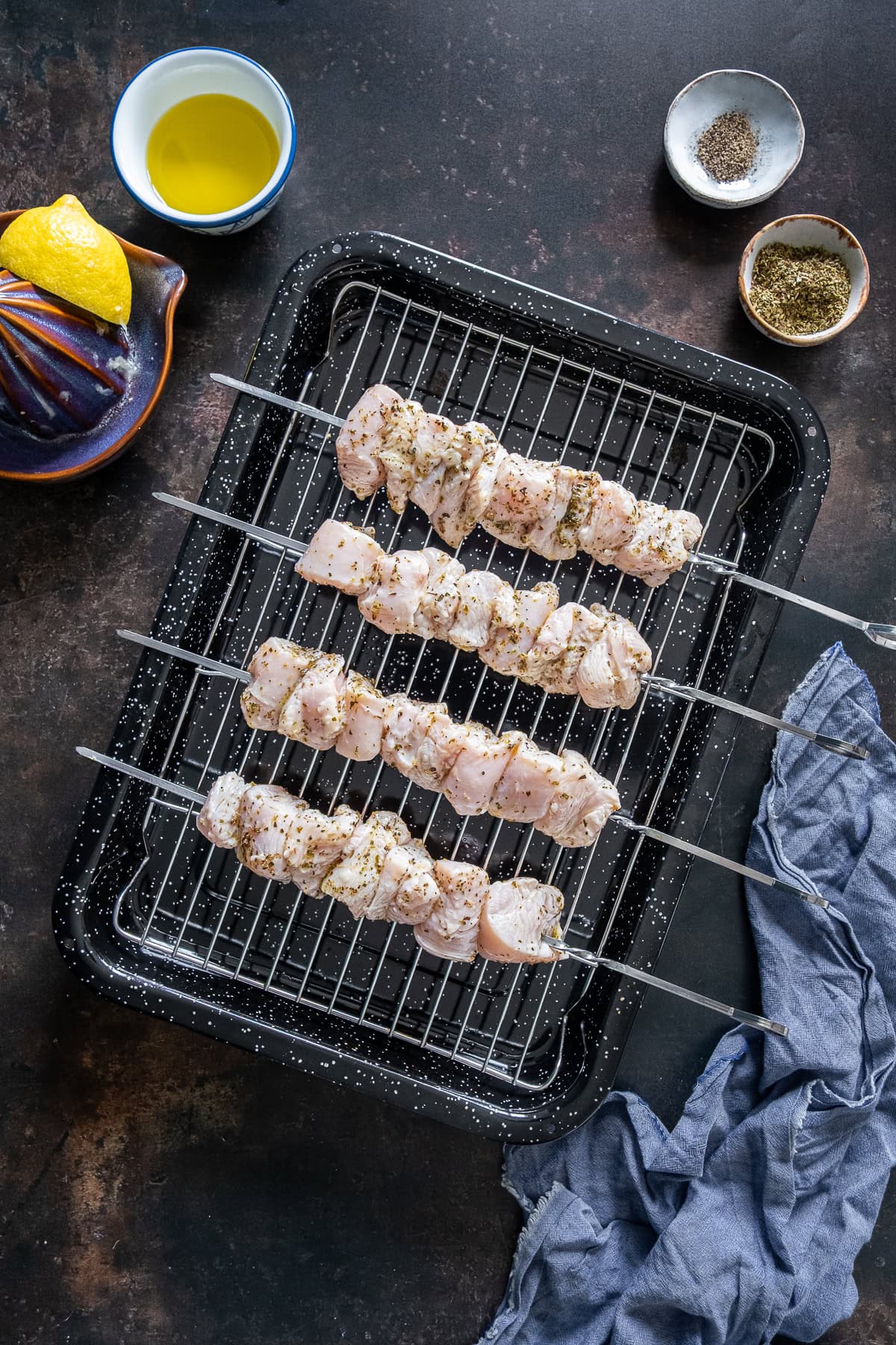 Raw chicken on skewers for Easy Chicken Souvlaki