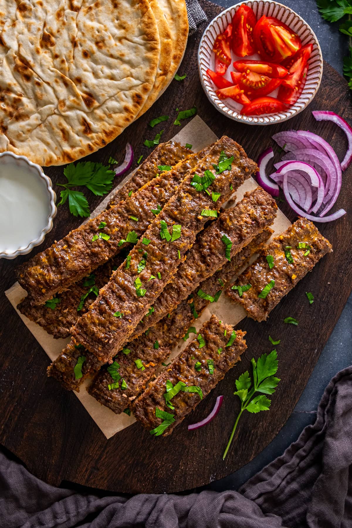 A pile of Sheet Pan Beef Kebabs on a serving board.